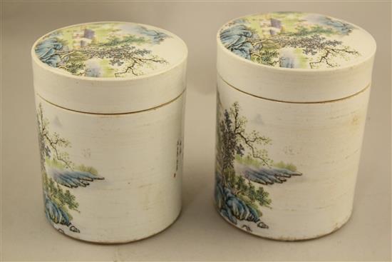 Two Chinese famille rose cylindrical jars and covers, 13cm and 13.5cm